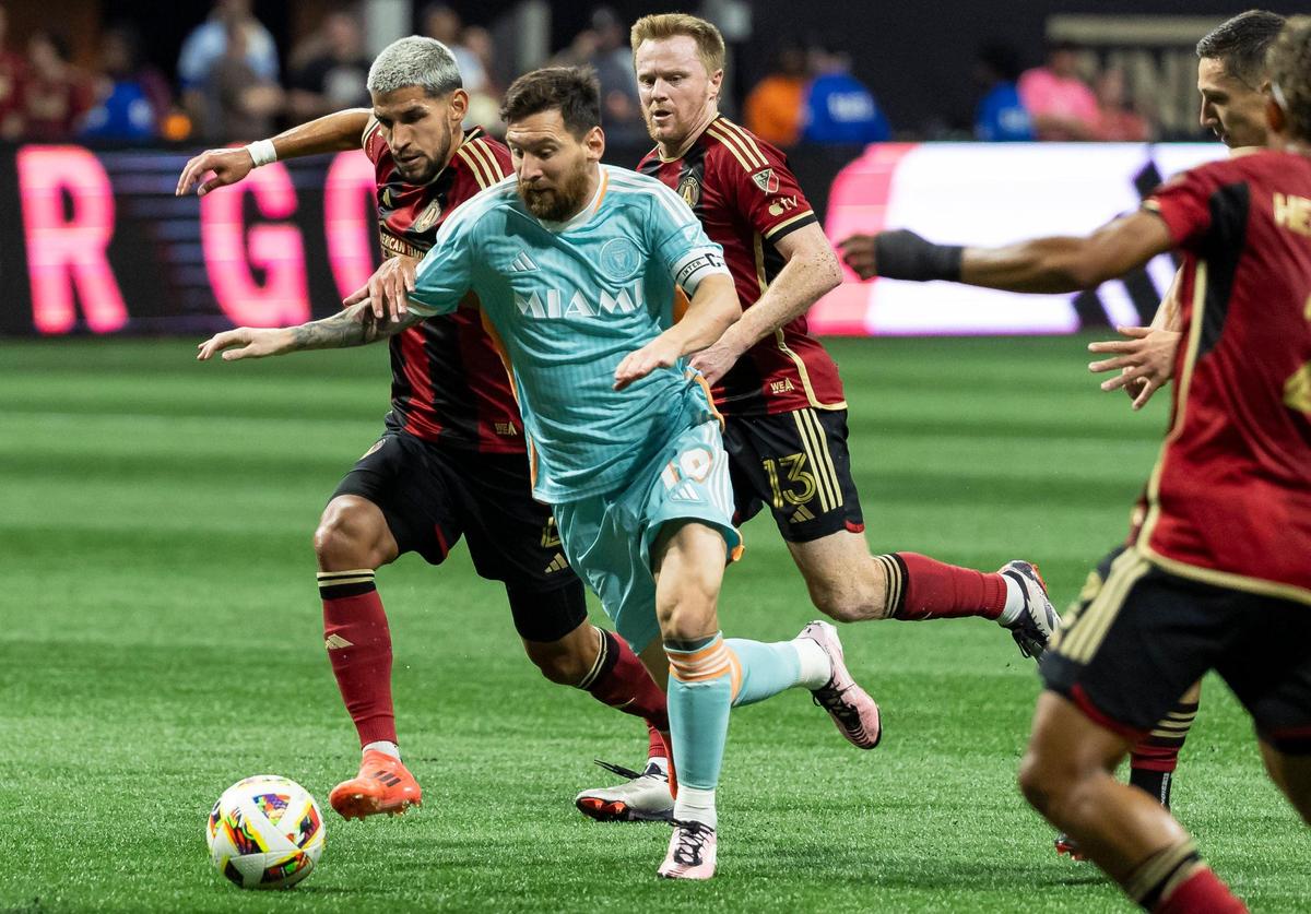 Inter Miami forward Lionel Messi (10) and Atlanta United defender Luis Abram (4) compete for the ball in the first half of match two of their MLS Playoffs series at the Mercedes-Benz Stadium on Saturday, Nov. 2, 2024, in Atlanta, Ga.