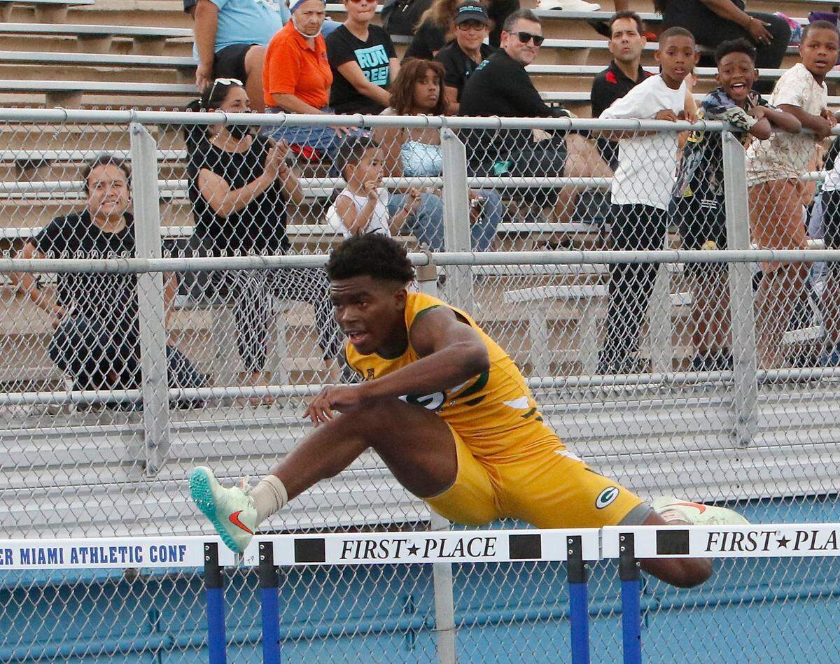 Miami Jackson’s Byron Holt wins boys110 meter hurdles during the GMAC Track and Field Championship on Thursday, April 7, 2022 at Traz Powell Stadium in Miami. Andrew Uloza / for THE MIAMI HERALD