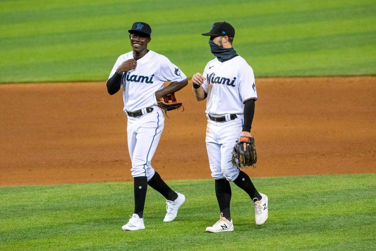 Miami Marlins second baseman Jon Berti (5) and infielder Jazz Chisholm (70) interact after the eighth inning of a Major League Baseball game against the Toronto Blue Jays at Marlins Park in Miami, Florida on Tuesday, September 1, 2020.