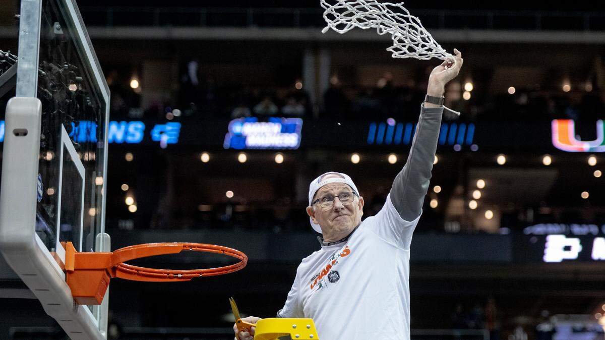 Miami head coach Jim Larrañaga twirls a basket’s net around his head after defeating Texas 88-81 in an Elite 8 college basketball game in the Midwest Regional of the NCAA Tournament, Sunday, March 26, 2023, in Kansas City.
