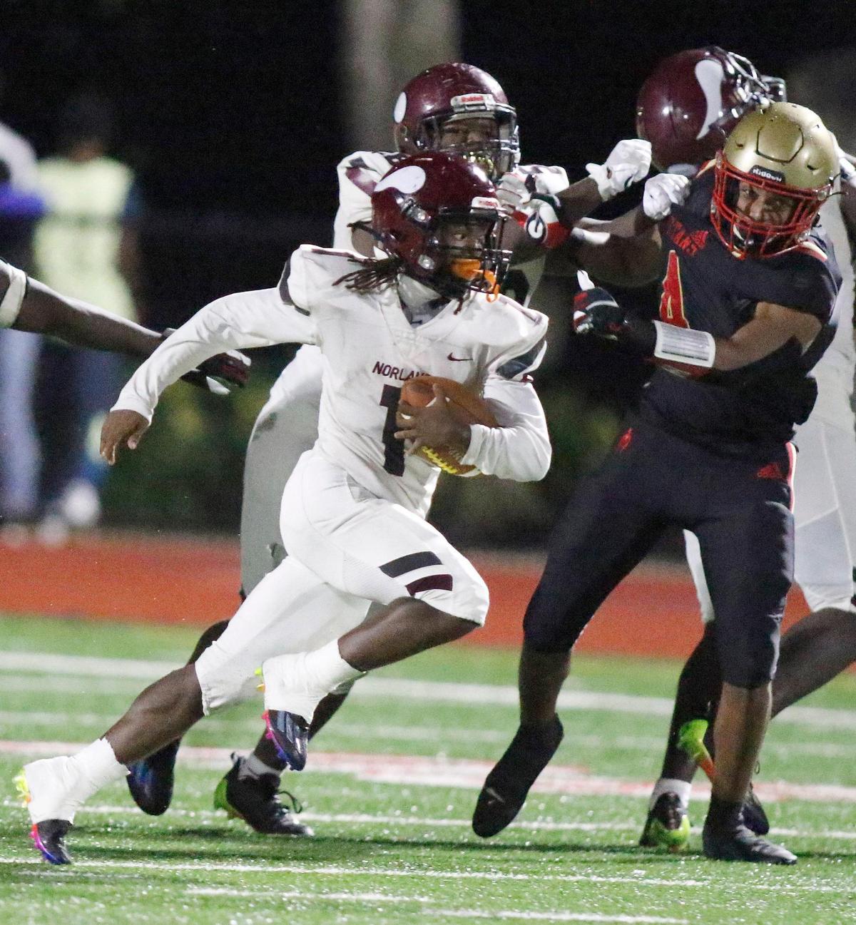 Norland Vikings running back Lemmie Faulk (1) gains yardage during the football game against Monsignor Pace Spartans on Friday, September 16, 2022 at Monsignor Pace HS in Miami. Andrew Uloza / for Miami Herald