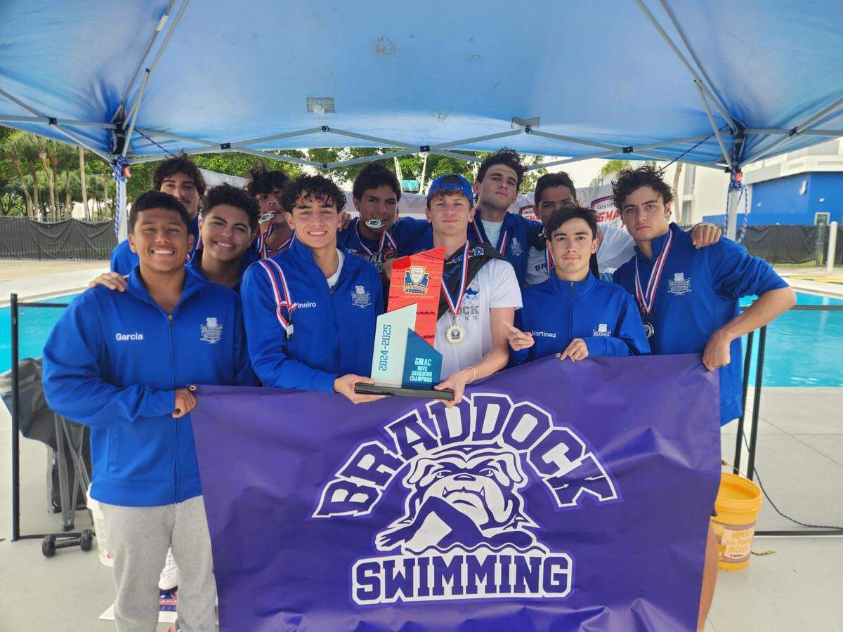 The Braddock boys’ swimming and diving team celebrates its GMAC championship on Thursday at Miami-Dade’s North campus.
