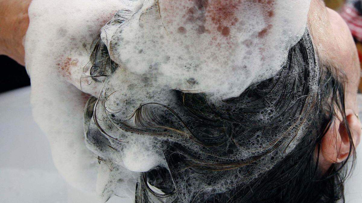 From fish oil soap to chickpea flour, here’s what TikTok creators are using to wash their hair. (AP Photo/Jens Meyer)
