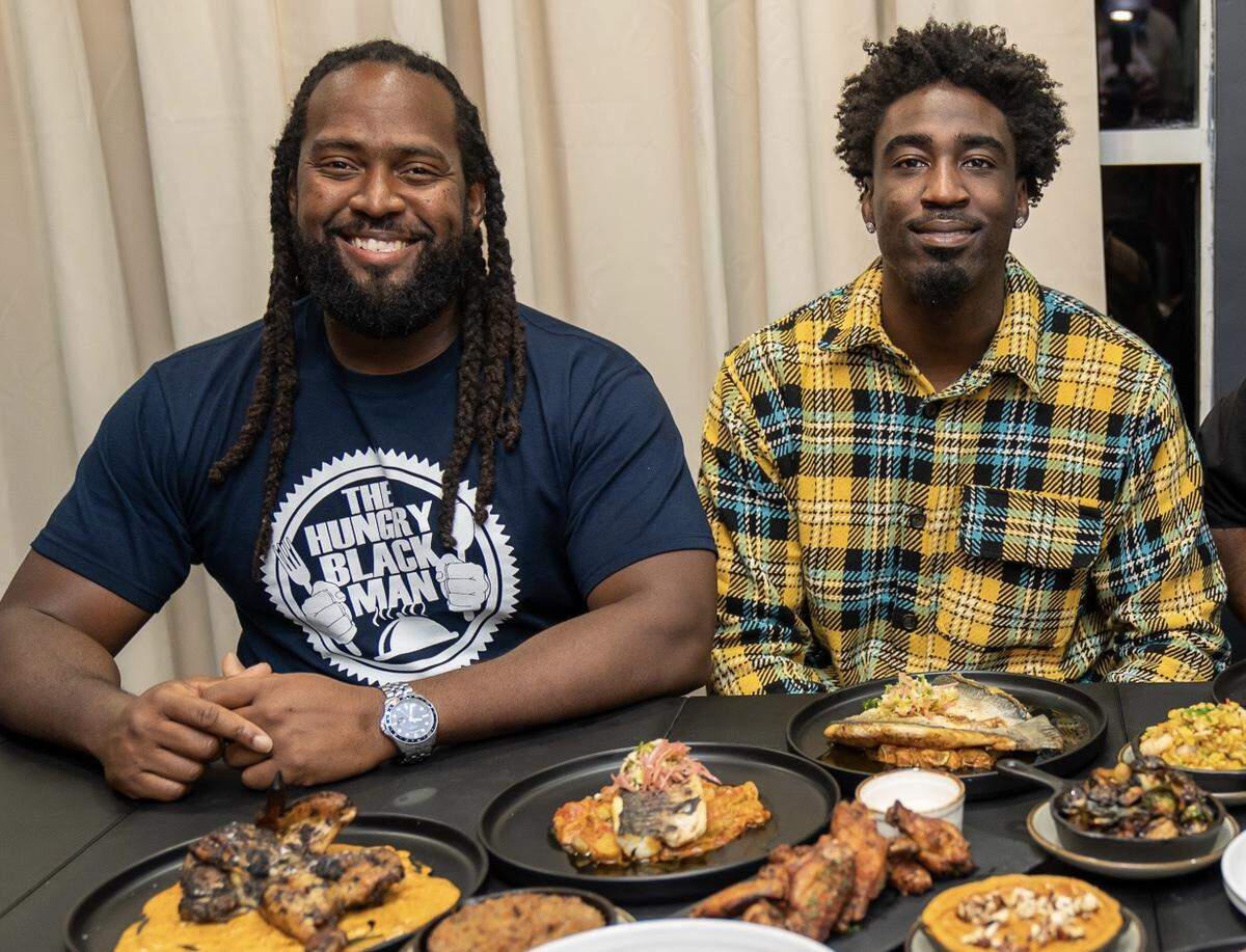 Food blogger Starex Smith, left, and Miami-born retired NFL player Kayvon Webster partnered to open Smith & Webster restaurant in North Miami.