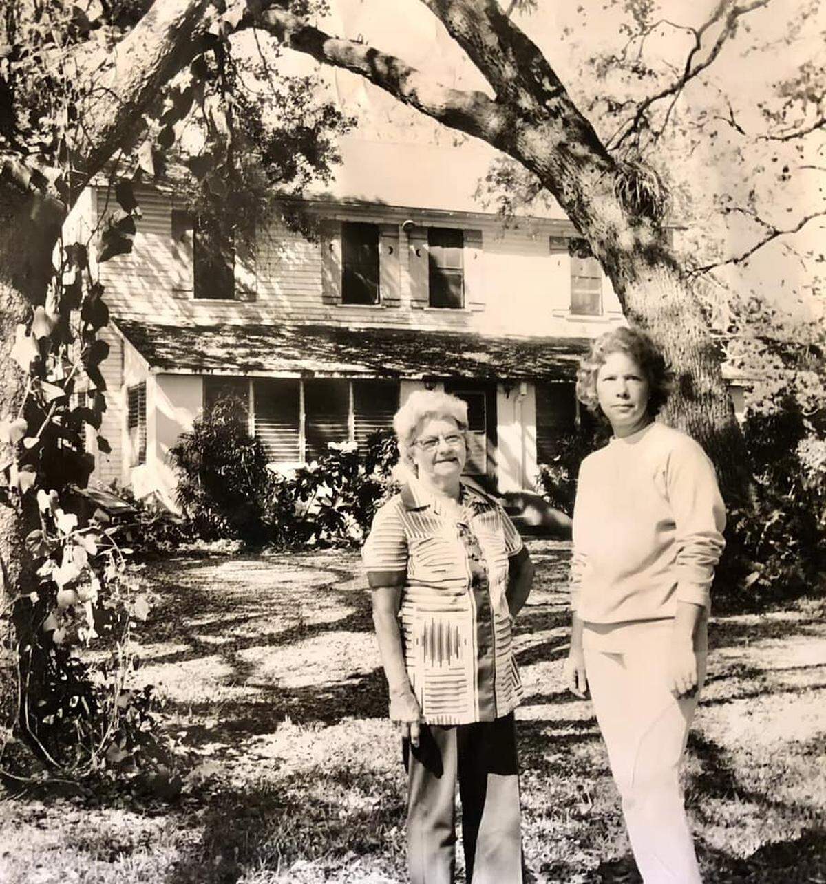 Residents stand outside the Bryan House, one of oldest houses in Broward County, in the 1960s. Several families lived in the house until it was left vacant for several years and fell into disrepair. 