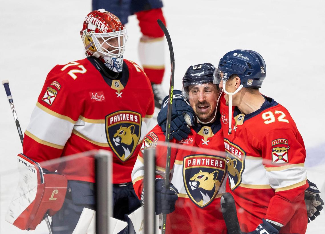 Florida Panthers center Brad Marchand (63) celebrates with goaltender Sergei Bobrovsky (72) and left wing Tomas Nosek (92) after scoring a goal against Toronto Maple Leafs goaltender Joseph Woll (60) in a Overtime period of Game 3 of a second-round Stanley Cup playoffs series at the Amerant Bank Arena on Friday, May 9, 2025, in Sunrise, Fla.