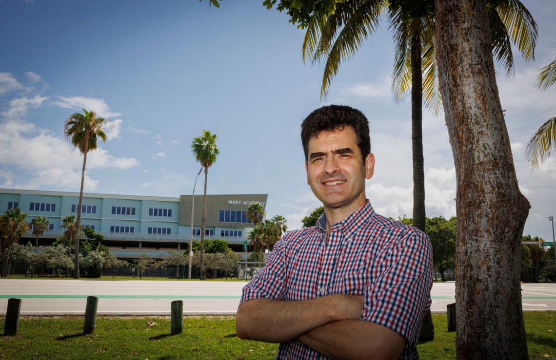 Otto Zequeira, a teacher from MAST Academy who is opposed to school vouchers, poses outside the school. “I see vouchers as a way to divide people against each other,” he said.