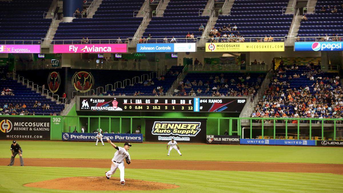 The Marlins are lowering season-ticket prices in an effort to boost attendance at a ballpark that has struggled to draw fans since its opening in 2012.