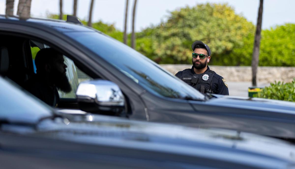A police officer directs traffic on Ocean Drive during spring break on Friday, March 8, 2024, in Miami Beach, Fla.&nbsp;