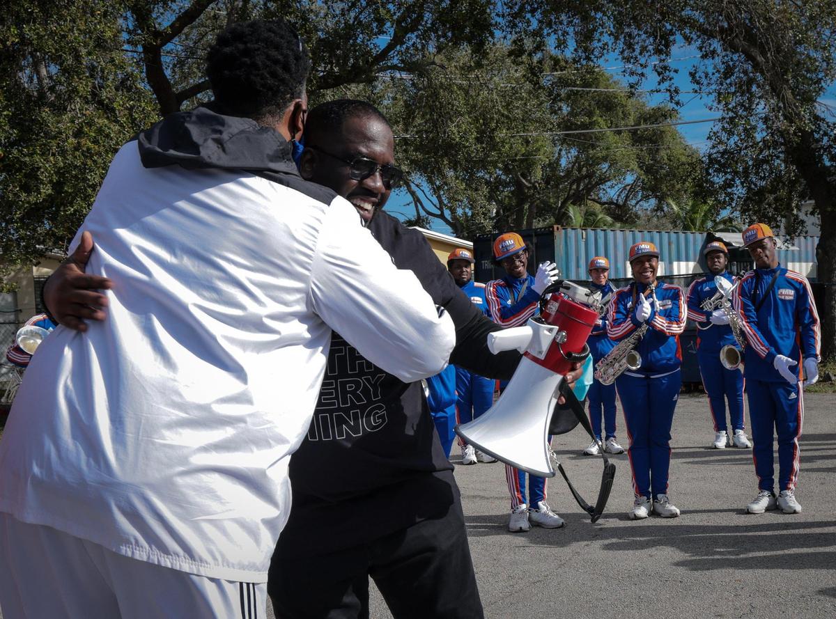 FMU band director Richard Beckford thanks Fedrick C. Ingram of the American Federation of Teachers, center, after addressing the Florida Memorial University Marching Band prior to their participation in the MLK parade in MIami, Florida. The 45th Annual MLK Parade traveled westbound on Northwest 54th Street starting on 12th Avenue featuring college and high school marching bands, politicians, City of Miami mounted police and motor units, police color guards, city and county fire/rescue trucks, Miami-Dade transit workers, and others on Monday, Martin Luther King Jr. Day, Jan, 17, 2022.