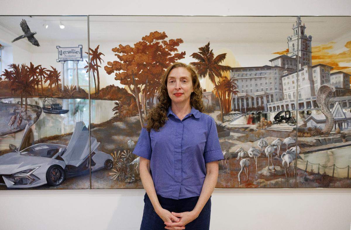 Artist Rachel Feinstein poses in front of her artwork entitled “Panorama of Miami.” The show is about childhood nostalgia in Miami and was inspired by her parents’ deaths. “I could not have made any of this had I grown up anywhere else,” said Feinstein.