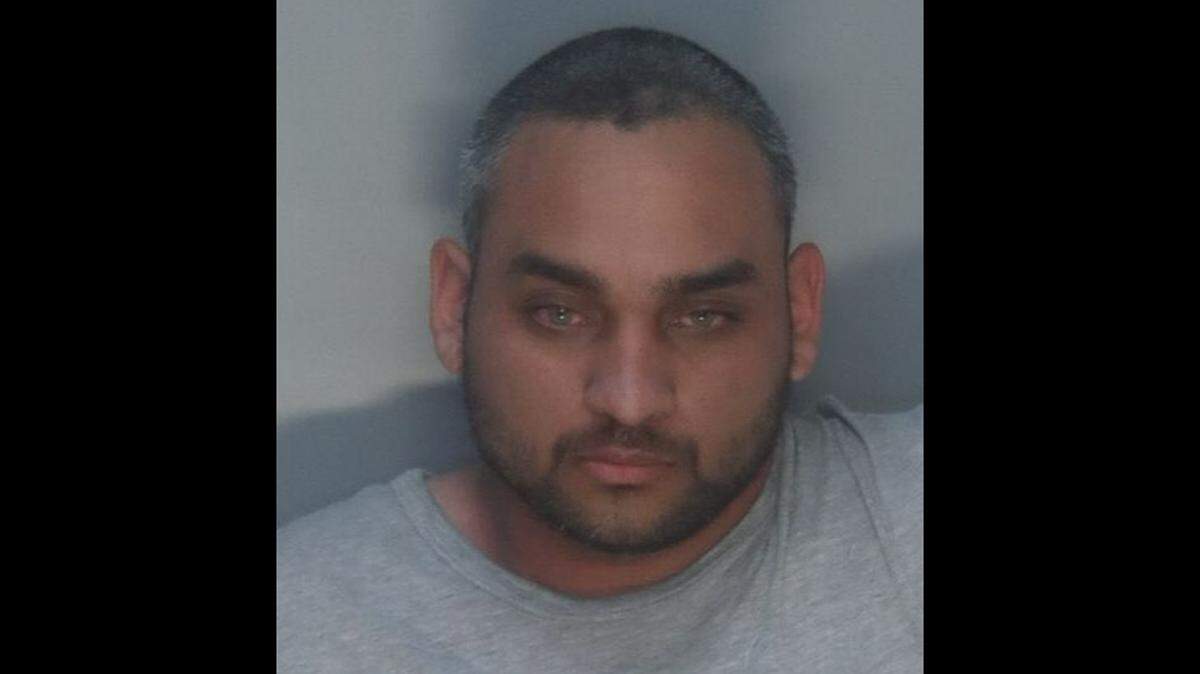 Aaron Quinones, 27, was arrested and charged with attempted felony murder after he tried to strangle a woman at a bus stop near Miami International Airport on the morning of Jan. 2, 2022, according to the Miami-Dade Police Department.