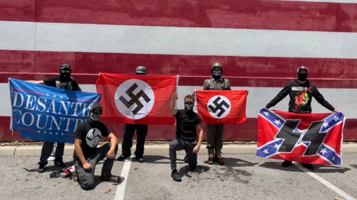 Members of the NSDAP neo-Nazi group at a May 2022 protest outside Disney World.