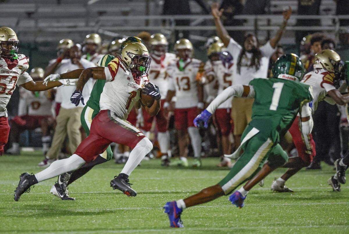 Coconut Creek running back Jorden Jett Thompson (1) scores in the first half against Mater Academy during the football playoff in the Region 4-5A quarterfinal at Milander Park in Hialeah, Florida on Friday, November 14, 2025.
