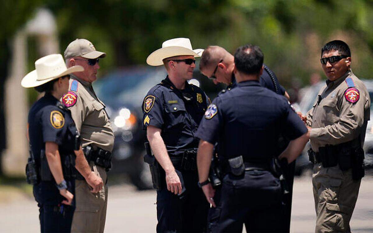 On June 3, members of law enforcement stand outside the funeral service for Jacklyn Cazares, a victim of the Uvalde school shooting.