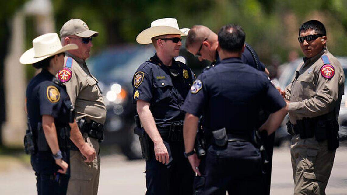 On June 3, members of law enforcement stand outside the funeral service for Jacklyn Cazares, a victim of the Uvalde school shooting.