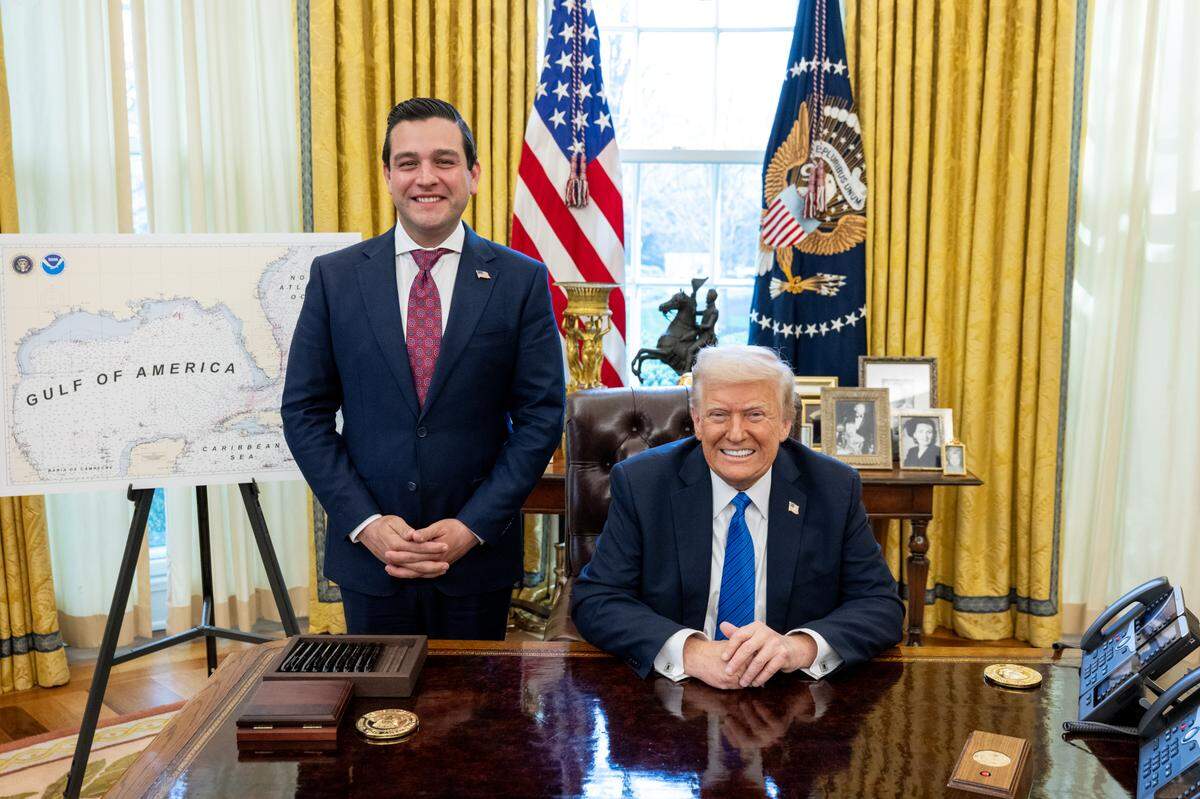 Miami-Dade Commissioner Kevin Cabrera poses with a seated President Donald Trump in the Oval Office on March 25, 2025, after a Senate committee advanced Cabrera’s nomination as ambassador to Panama.