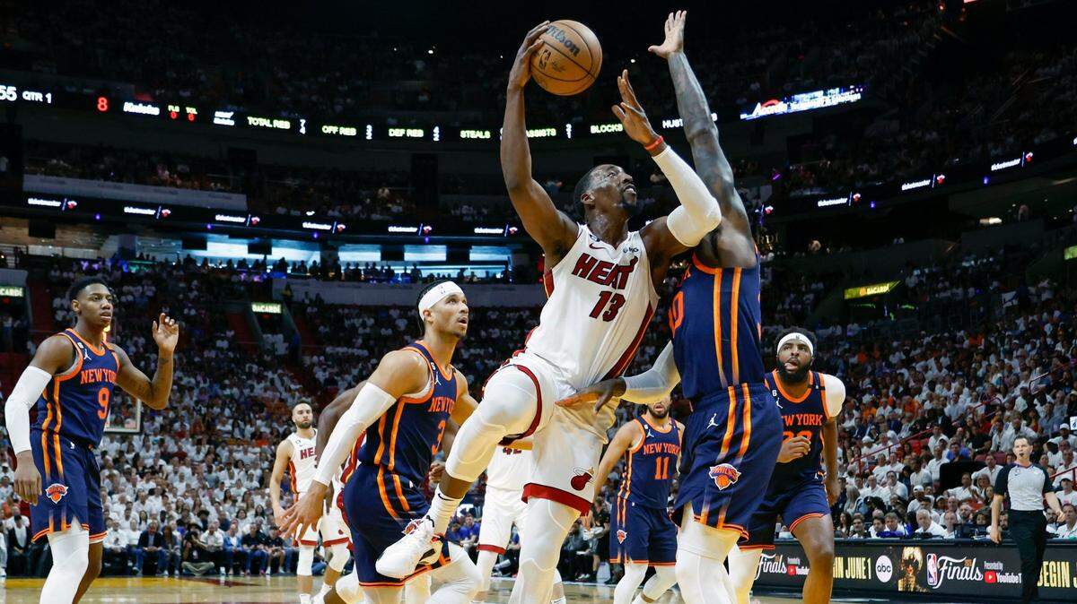 Miami Heat center Bam Adebayo (13) drives inside the paint as New York Knicks forward Julius Randle (30) defends in the first quarter in Game 3 of the NBA Eastern Conference Semifinals at the Kaseya Center in Miami on Saturday, May 6, 2023.