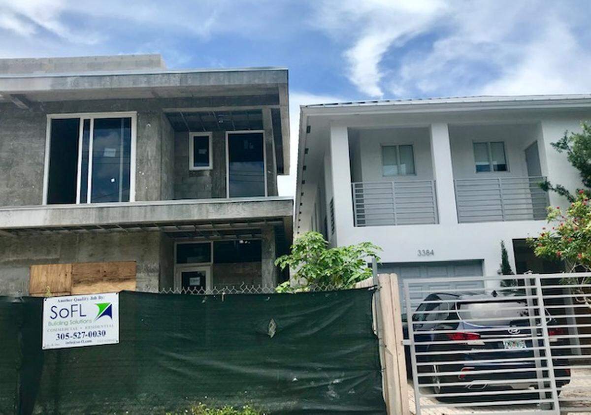 Two houses on the 3300 block of Day Avenue in West Coconut Grove are so close together that only 4 feet, 10 inches of space separate them despite a Miami zoning law that requires 10 feet of setback space.