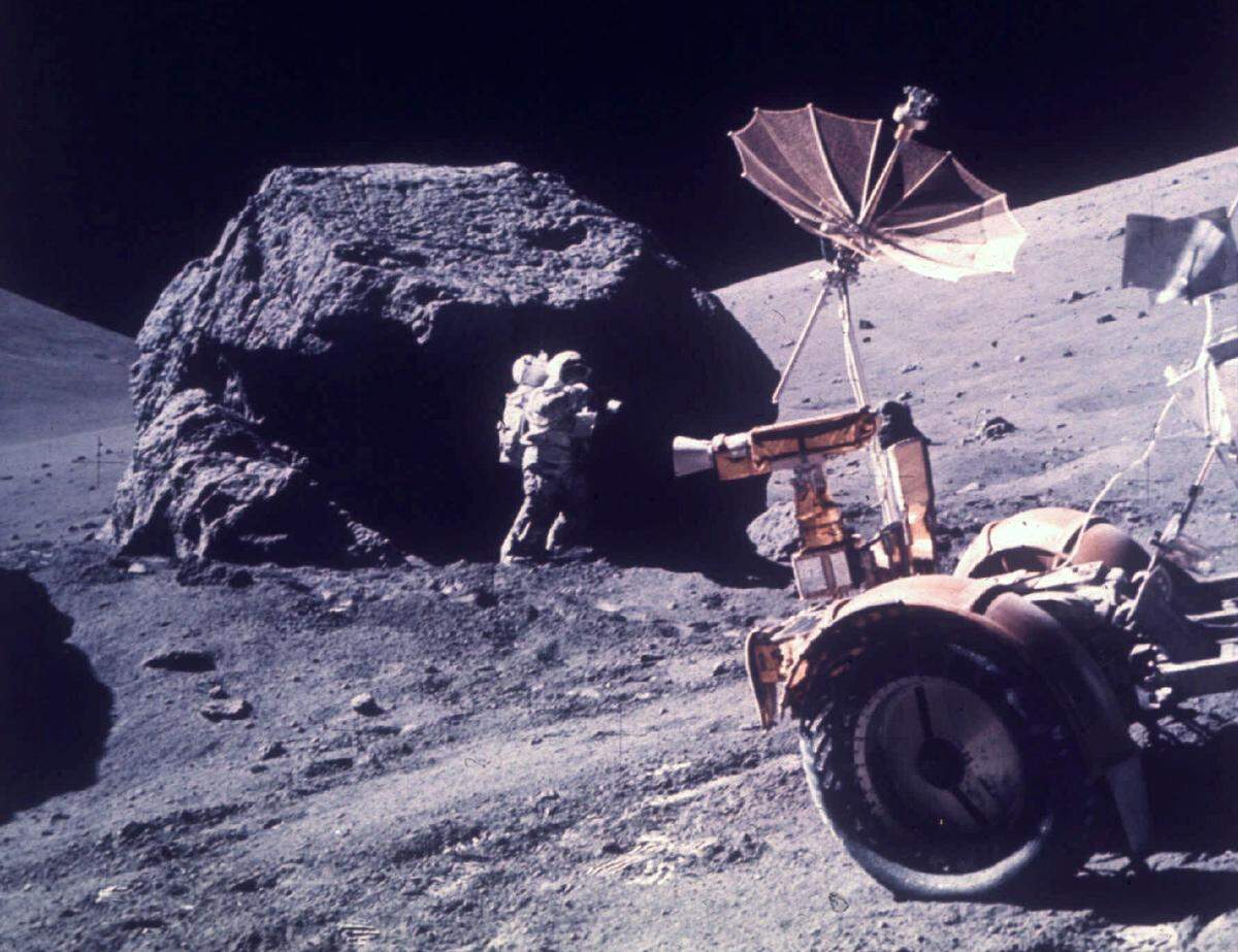 Astronaut Harrison H. Schmitt works beside a huge boulder at Station 6 during the third Apollo 17 extravehicular activity at the Taurus-Littrow landing site on the moon, Dec. 13, 1972. (AP Photo/NASA, File)
