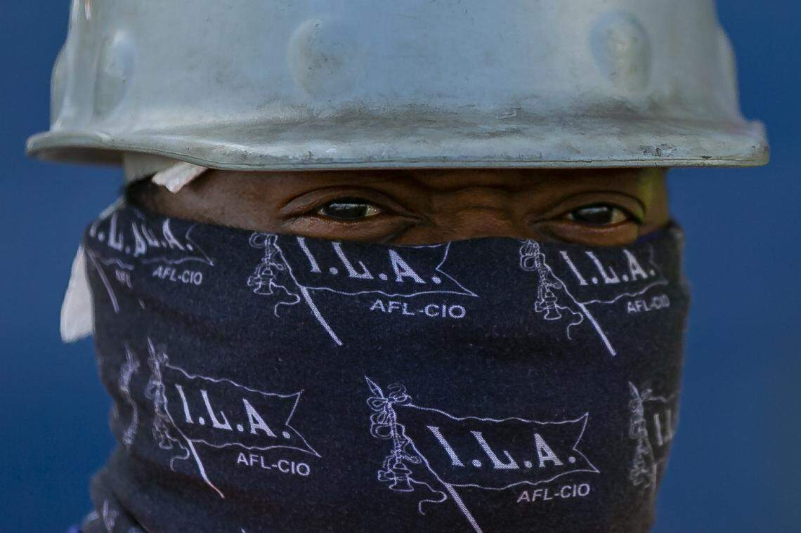 Longshoreman Clarence Pittman III works to unload a cargo ship at PortMiami on Saturday, February 20, 2021. Pittman, a top men, has been working as a longshoreman for 28 years.
