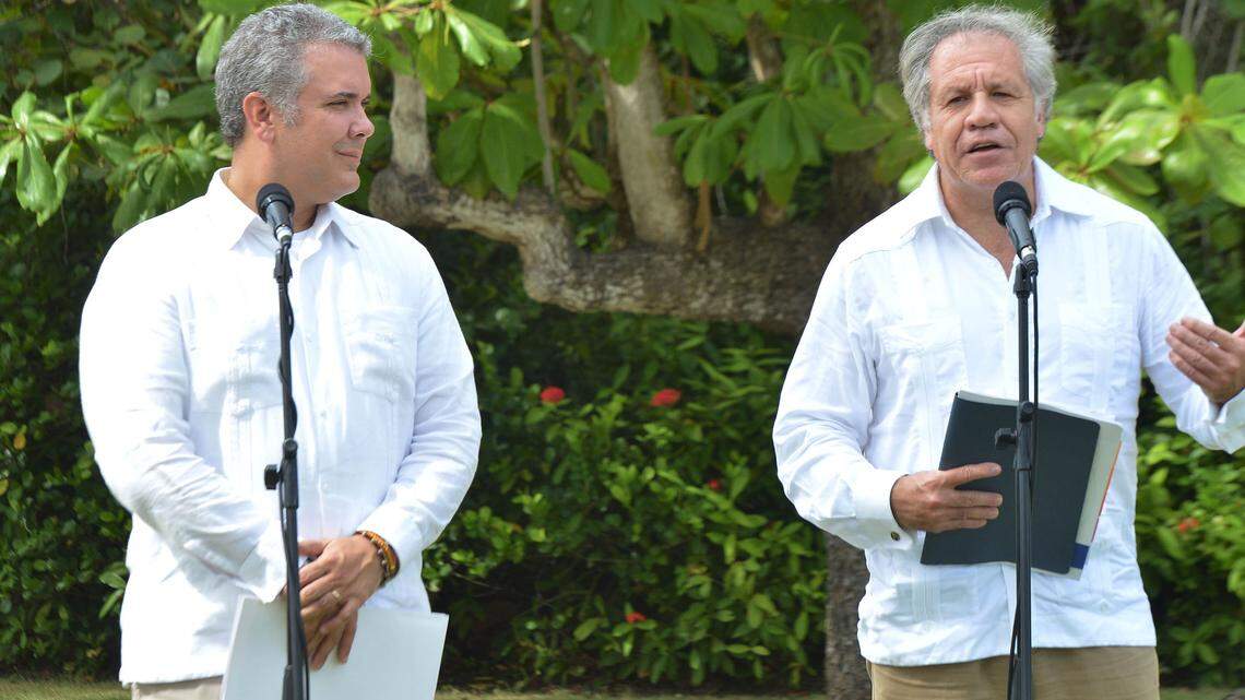 OAS Secretary General Luis Almagro, right, discusses the regional Venezuelan migrant crisis after meeting with Colombian President Ivan Duque in in Cartagena, Colombia. The U.N. estimates that more than 1.6 million Venezuelans have moved abroad since 2015, amid their nation’s economic and social collapse.