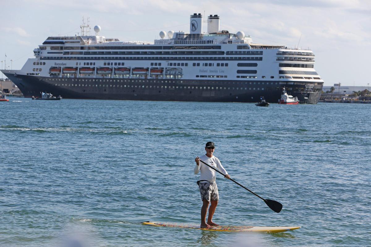 Paddleboarder Tim Bascombe of Fort Lauderdale was surprised to see all the activity surrounding the docking of cruise ships the Zaandam and the Rotterdam on April 2, 2020. The Zaandam cruise ship with COVID-19 passengers on board was permitted to dock at Port Everglades after 12 days at sea.