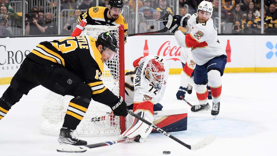 Panthers goaltender Sergei Bobrovsky tries to sweep the puck away from Boston Bruins center Charlie Coyle (13) during the first period in game five of the first round of the 2023 Stanley Cup Playoffs at TD Garden. Bob DeChiara-USA TODAY Sports