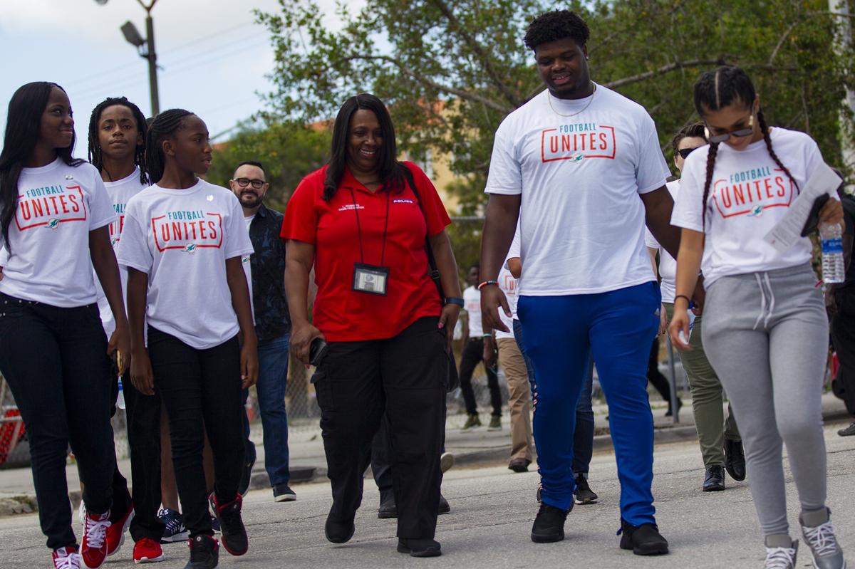 Miami Dolphins’ defensive tackle Jamiyus Pittman (65) walks toward Overtown’s Historic Lyric Theater during the Football Unites: Cultural Tours on Tuesday, September 18, 2018. The event unites Miami Dolphins players, alumni and staff with community leaders and law enforcement to experience the cultural diversity of South Florida.