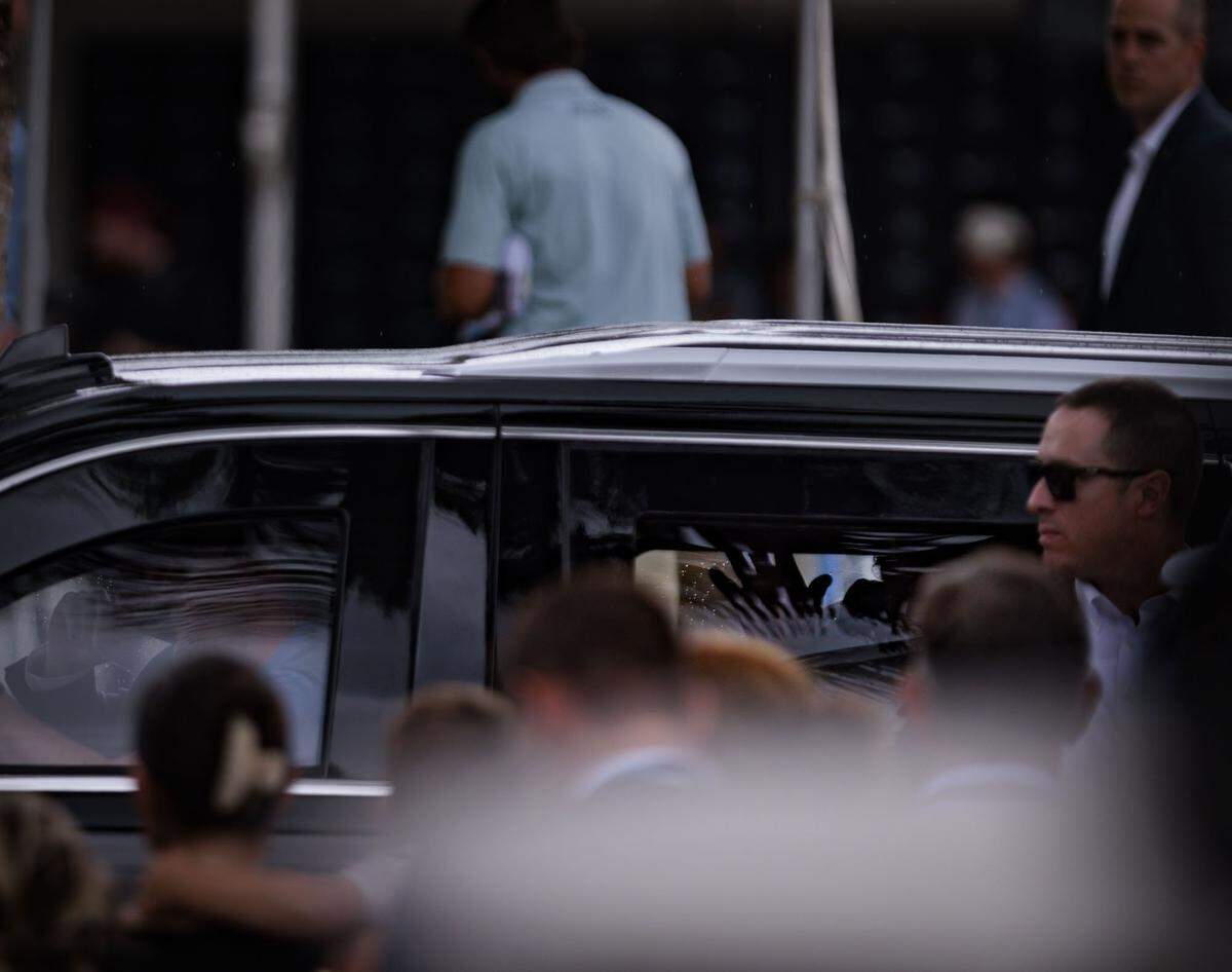 President Donald Trump waves to fans through the window of the car after the final round of the Cadillac Championship PGA Tour on Sunday, May 3, 2026, at Trump National Doral in Doral, Fla.