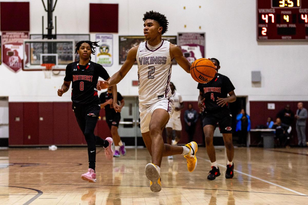 Norland forward Tristan Wilson (2) drives toward the basket while chased by Northeast defenders Landen Jospeh (0) and Bernard Sius (4) during the Regional 4-5A boys basketball semifinal in Miami Gardens, Florida on Tuesday, February 20, 2024.
