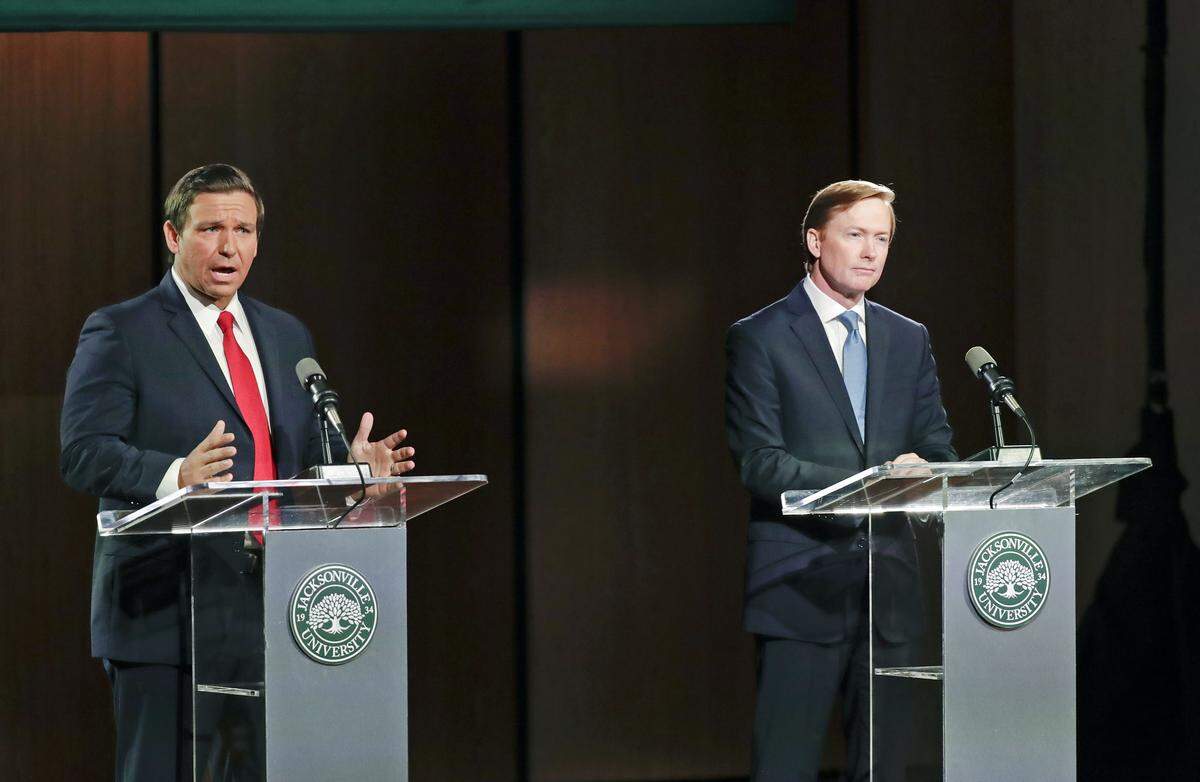 Republican gubernatorial candidates Ron DeSantis, left, and Adam Putnam debate Wednesday, Aug. 8, 2018, in Jacksonville.