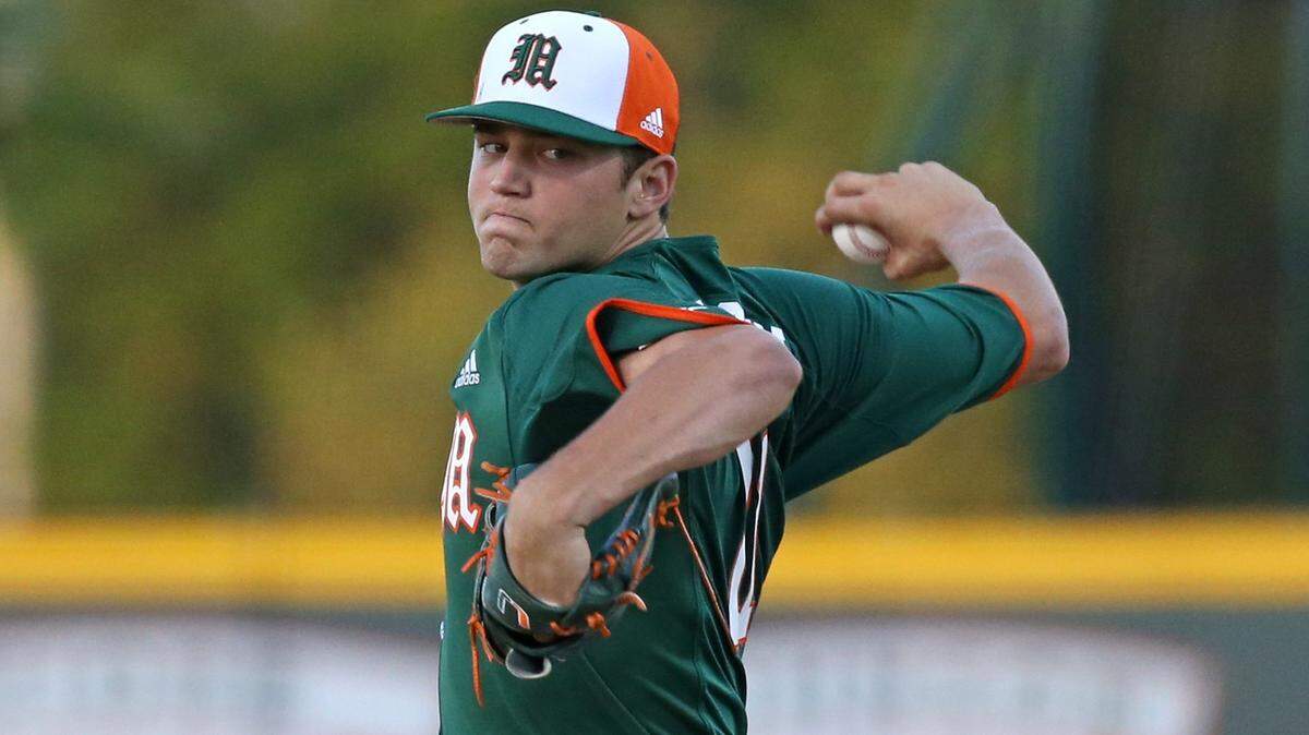 Miami Hurricanes pitcher Slade Cecconi (21) pitches during the first inning of a NCAA baseball game against the Florida Atlantic University Owls at Alex Rodriguez Park at Mark Light Field on Wednesday, February 20, 2019 in Coral Gables.