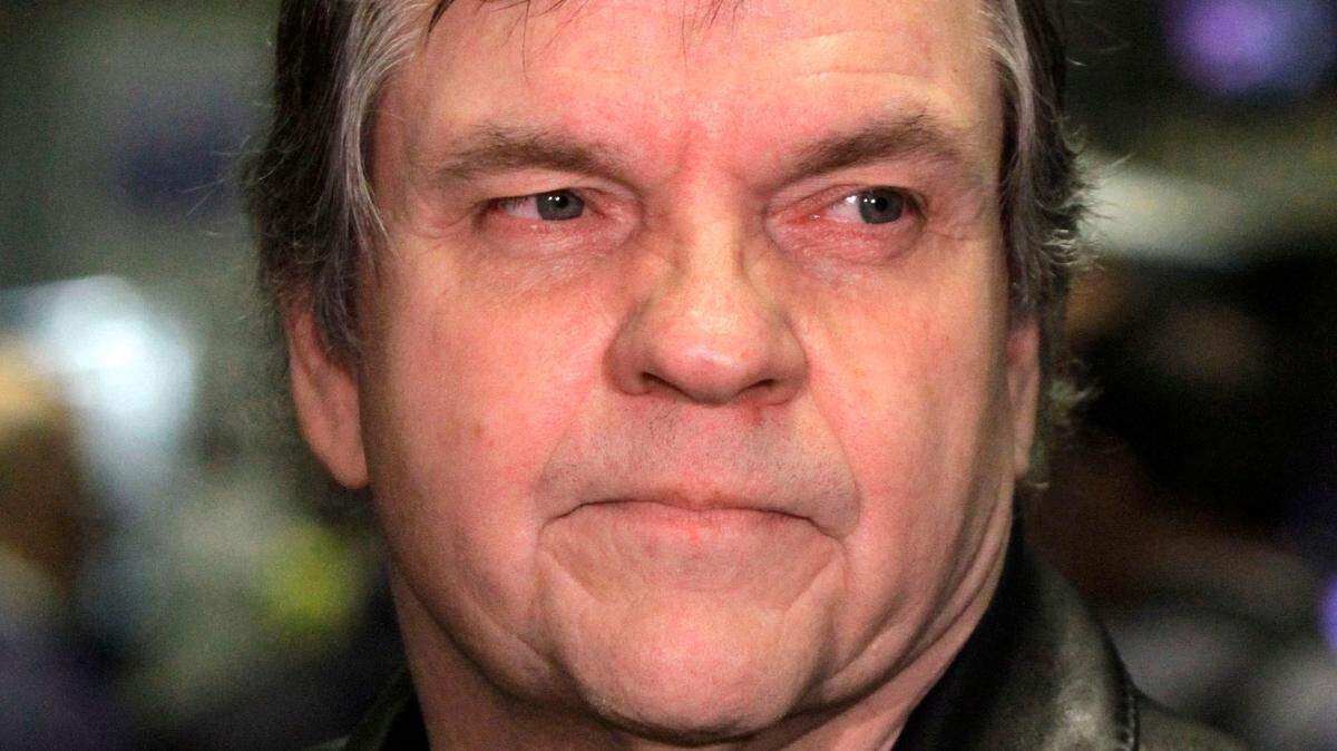 FILE - This June 21, 2010, file photo shows rock singer Meat Loaf on the floor of the New York Stock Exchange before ringing the opening bell. Meat Loaf, whose “Bat Out Of Hell” album is one of the all time bestsellers, has died, family said on Facebook, Friday, Jan. 21, 2022.