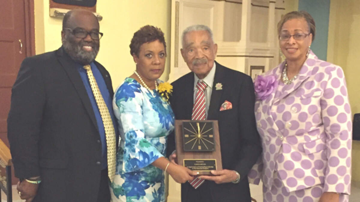 Andy Ingraham, of the South Florida  Bahamian diaspora, left, Bahamas Consul General Florida Linda Mackey and Deputy Consul General Florida Sandra Carey present a plaque to Garth C. Reeves at the 2018 Bahamian independence celebration.