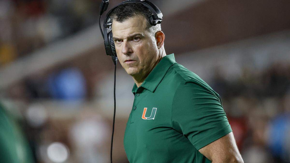 Miami Hurricanes head coach Mario Cristobal walks on the field duriong a timeout in the second half of the NCAA game against the Florida State Seminoles at Doak Campbell Stadium in Tallahassee, Florida, on Saturday, October 4, 2025.