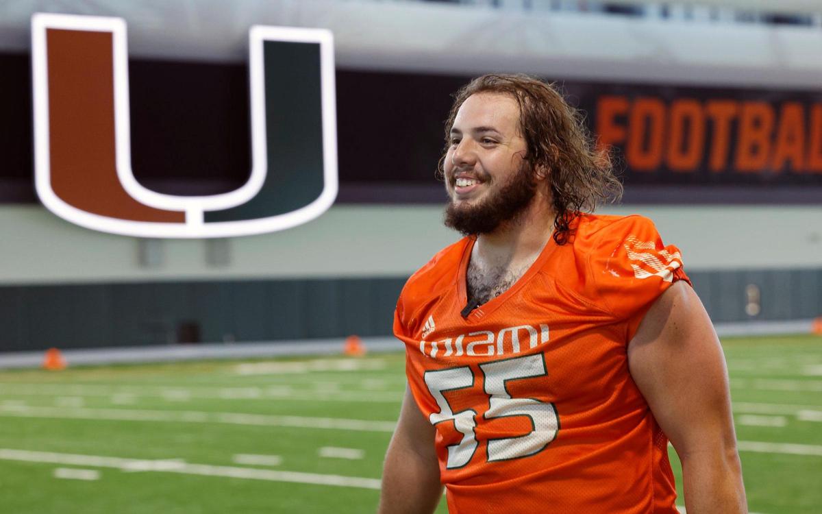 Miami Hurricanes offensive lineman Jacob Lichtenstein (55) walks through the Carol Soffer Indoor Practice Facility after football practice at the University of Miami’s Greentree Field on Thursday, March 9, 2023.