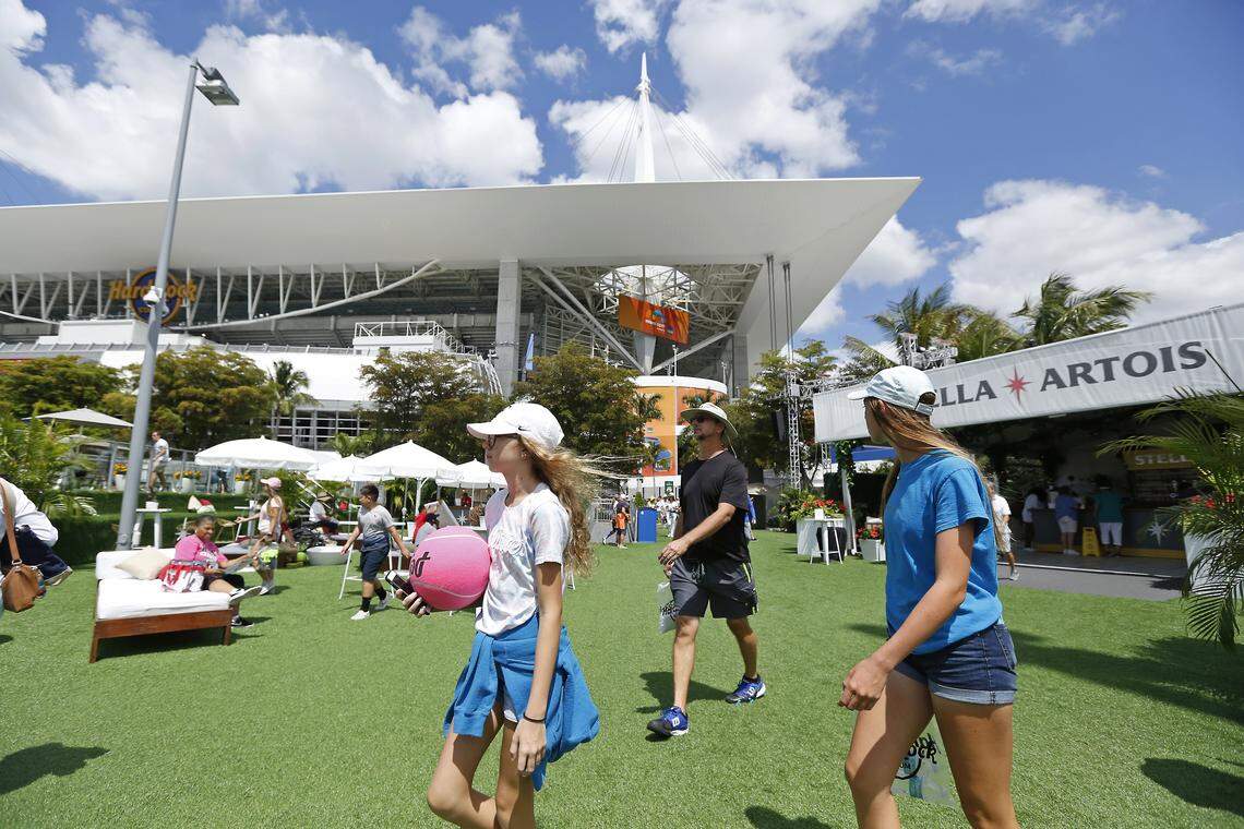 Tennis fans walk outside the stadium during the fourth day of Miami Open tennis tournament on Thursday, March 21, 2019 at Hard Rock Stadium in Miami Gardens.