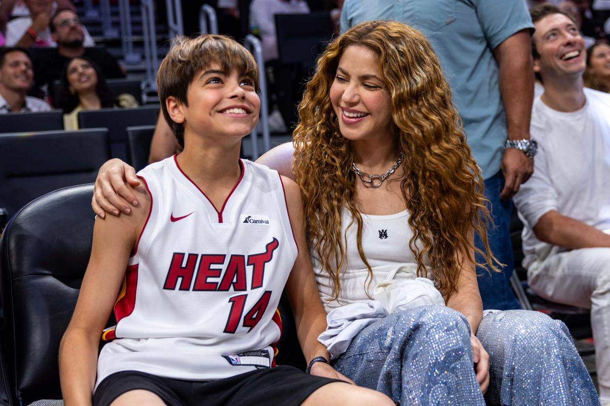 Shakira, right, sits with her son Milan, left, during the second half of Game 3 of the NBA Playoffs between the Miami Heat and the Cleveland Cavaliers at Kaseya Center on Saturday, April 26, 2025, in Miami, Fla.