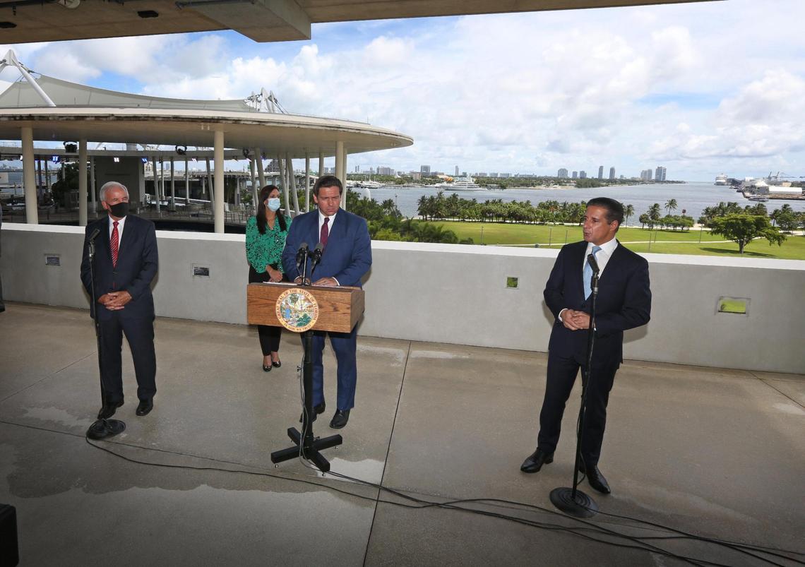 Gov. Ron DeSantis, center, announced on Friday, Sept. 11, 2020 that both Miami-Dade and Broward counties will be moving to Phase 2 in the coronavirus pandemic reopening schedule. This move will allow both counties’ school systems to begin resuming in-person learning. The option for distance learning will also remain in place. DeSantis was accompanied by Lt. Gov. Jeanette Nuñez, Miami-Dade County Mayor Carlos Gimenez, left, and Miami-Dade Schools Superintendent Alberto Carvalho, right, at the press conference at the Phillip and Patricia Frost Museum of Science.
