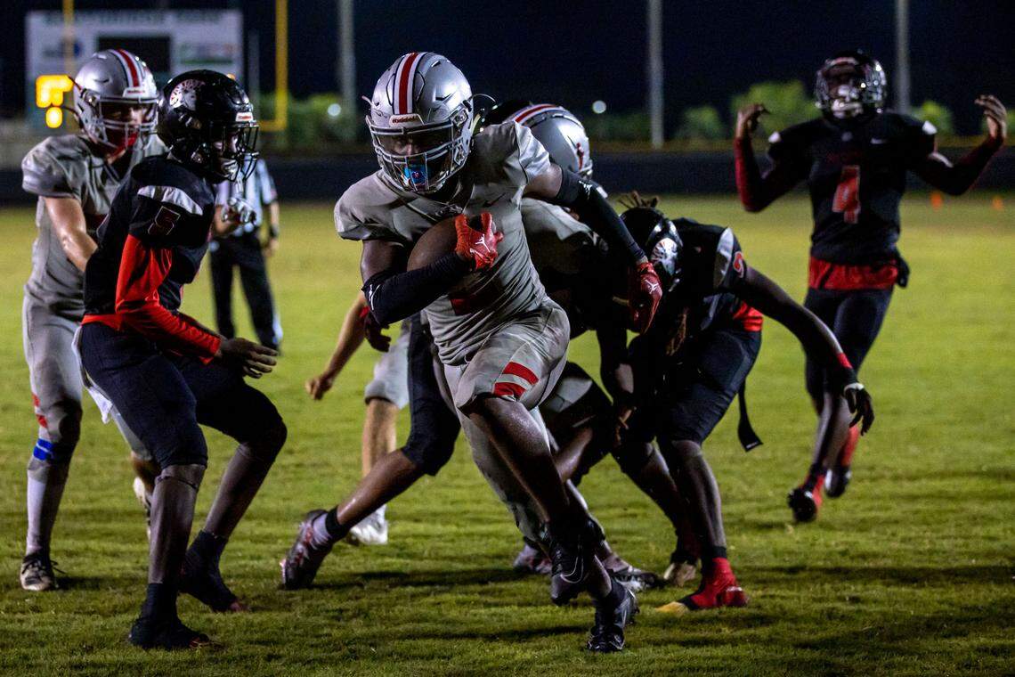 Doral Academy running back Mark Wilder (2) scores a touchdown during the over time of an high school football game against Miami Southridge at South Ridge Park in Miami, Florida, on Friday, September 24, 2022.