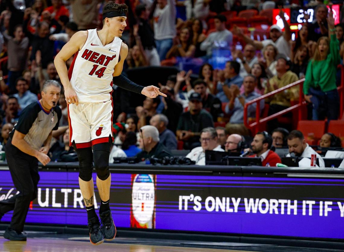 Miami Heat guard Tyler Herro (14) reacts after sinking a three-pointer against the Atlanta Hawks in the fourth quarter at Kaseya Center in Miami, Florida on Friday, December 22, 2023.