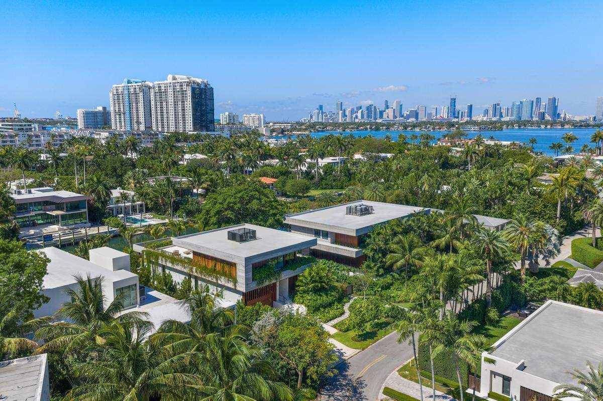 Sunset Estates is made up of two residences on adjacent lots in the gated Sunset Islands III community.