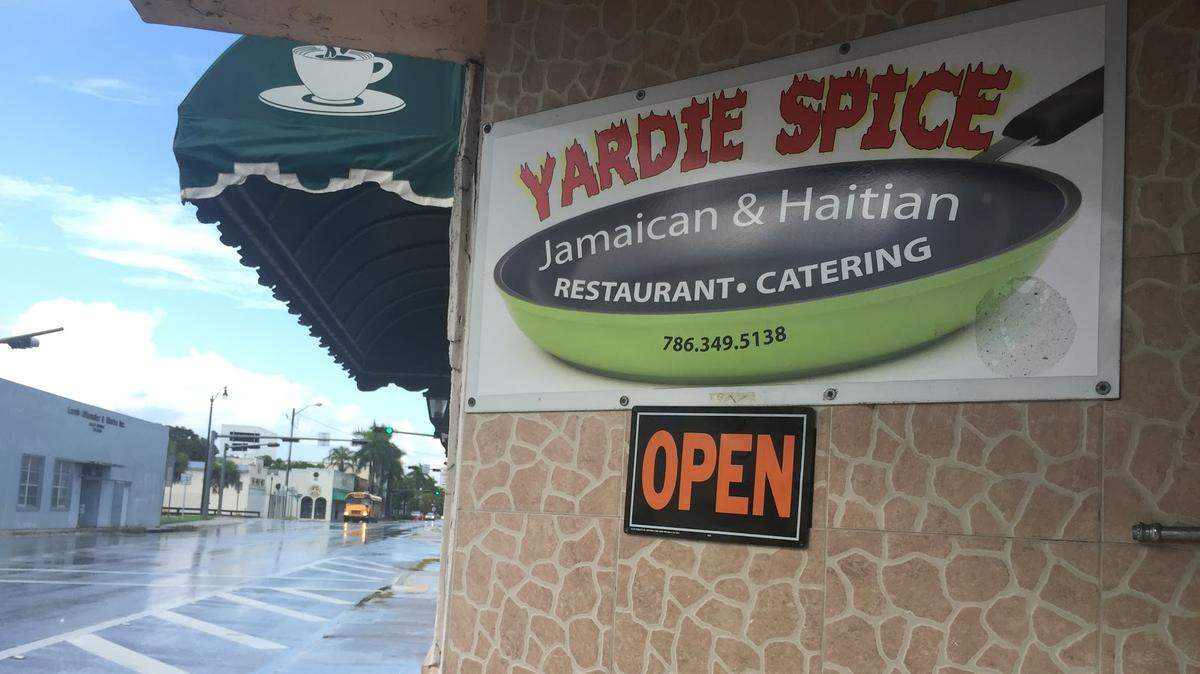 The sign outside Yardie Spice, a Jamaican/Haitian restaurant in Homestead.