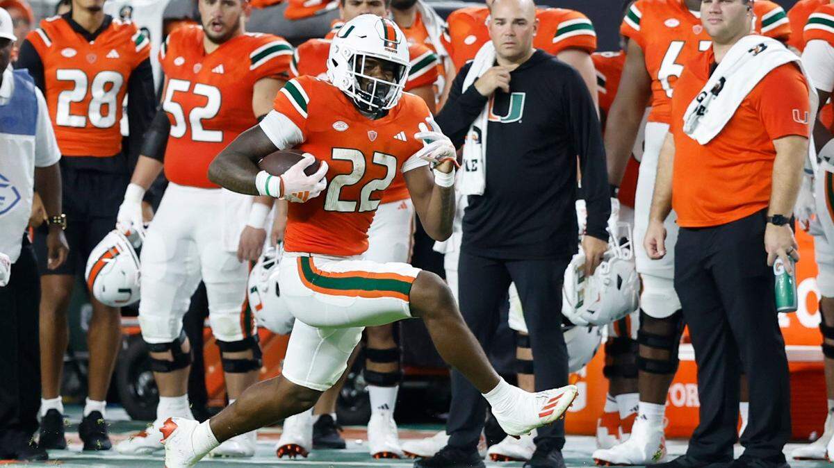 Miami Hurricanes running back Mark Fletcher Jr. (22) carries for a first down in the first half against Miami of Ohio Redhawks in the first half at Hard Rock Stadium in Miami Gardens, Florida on Friday, September 1, 2023.