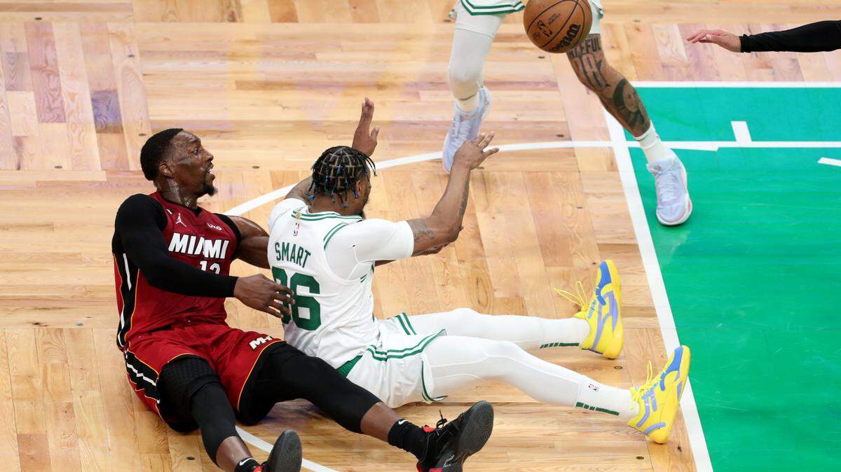 Boston Celtics guard Marcus Smart (36) passes in front of Miami Heat center Bam Adebayo (13) during the second quarter in game one of the Eastern Conference Finals for the 2023 NBA playoffs at TD Garden.