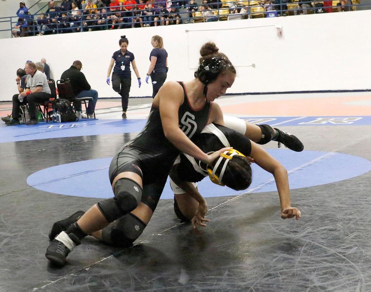 Stoneman Douglas’ Gabriela Caro wrestles Nova’s Nayara Stubna during the 130-pound BCAA wrestling championship on Saturday, February 3, 2024 at Pompano Beach High.
