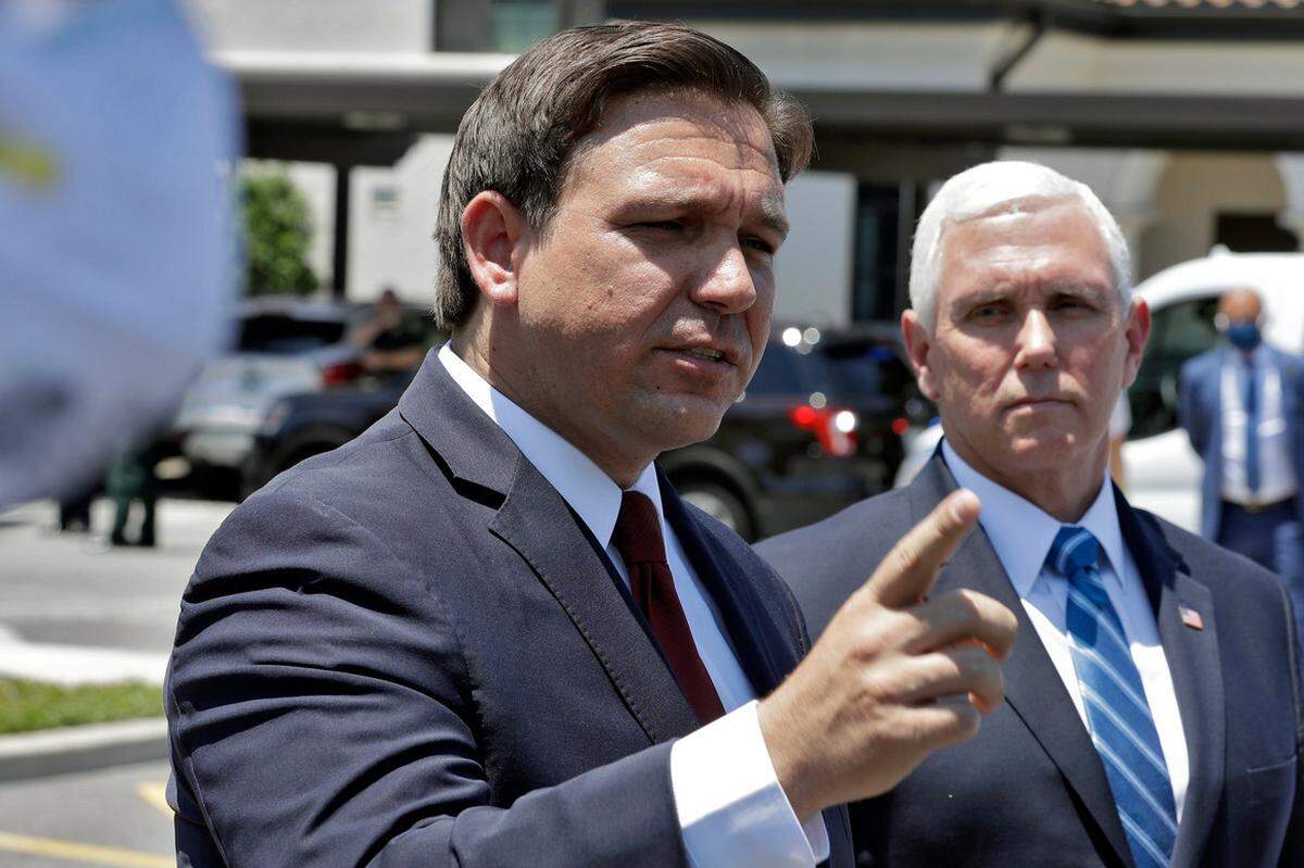 As Vice President Mike Pence watched, Florida Gov. Ron DeSantis assailed former health department data expert Rebekah Jones.