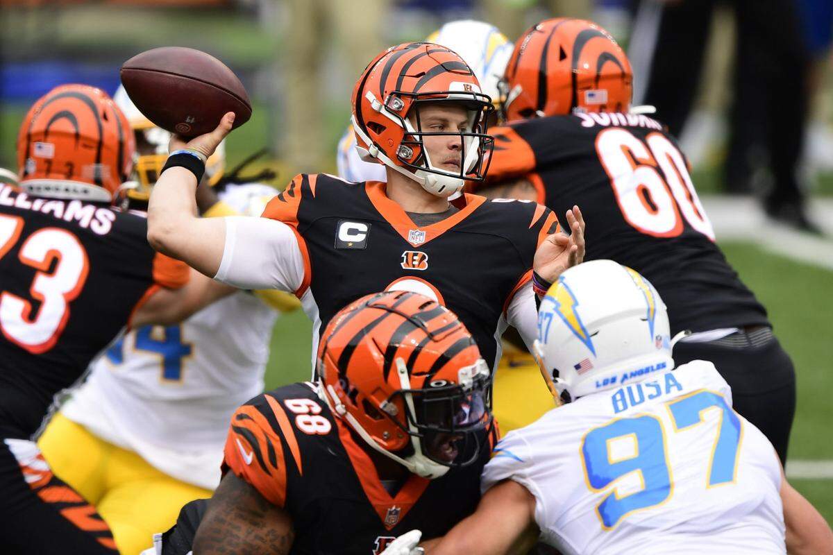 Cincinnati Bengals quarterback Joe Burrow (9) looks to pass during an NFL football game against the Los Angeles Chargers, Sunday, Sept. 13, 2020, in Cincinnati. (AP Photo/Emilee Chinn)
