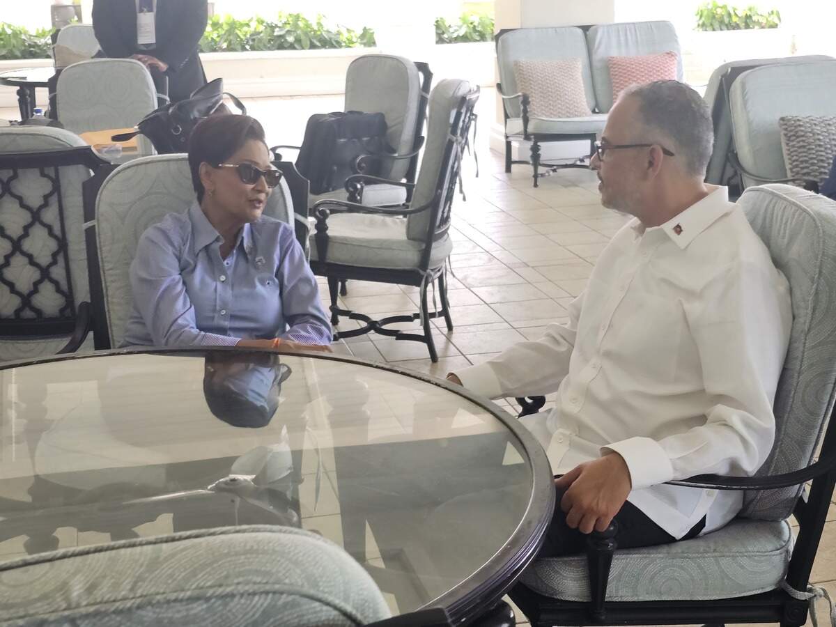 Trinidad and Tobago Prime Minister Kamla Persad-Bissessar speaks with Haiti Prime Minister Alix Didier Fils-Aimé on Monday, July 6 2026, during the Caribbean Community, CARICOM, regular meeting in St. Lucia.